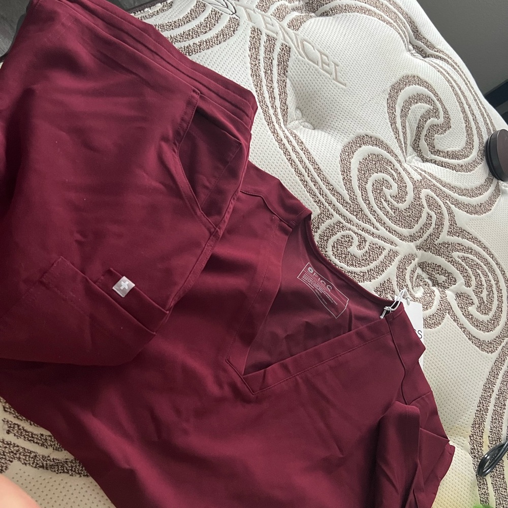 women’s burgundy figs scrubs. 3 pocket large scrub top. skinny tall bottoms.